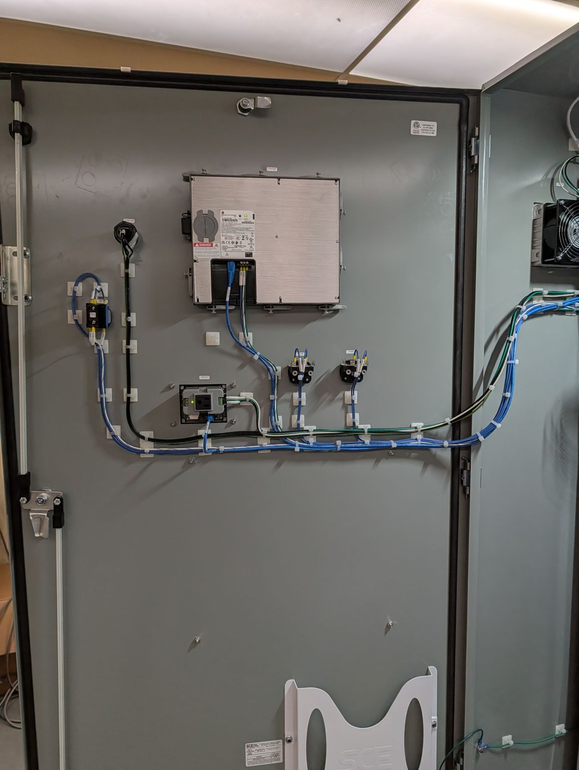 Control panel interior with wiring and mounted industrial PC