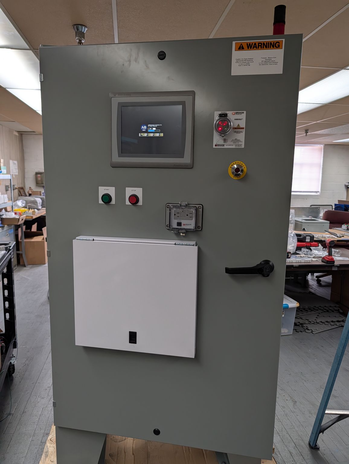 Completed control panel with HMI, E-stop, and status indicators